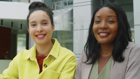 Portrait-of-Two-Cheerful-Multiethnic-Businesswomen